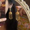 2025 nuevos aretes de borla de oro con diamante rojo estilo nacional para mujer aretes largos retro de lujo ligero aretes aretes nuevos