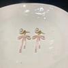 Pendientes de lazo de perla gris Cool Sense para mujer, ligeros, de lujo, de alta gama, estilo frío, elegantes, accesorios para las orejas.