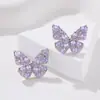 Pendientes de aguja de plata s925 nicho elegante simple combinable para mujer pendientes de mariposa danzante con incrustaciones de circonita de alta calidad