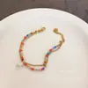 Pulseira Dourada de Titânio com Contas de Cristal Coloridas Estilo Arroz Coreano Pulseira Elegante Doce Francesa Joia de Mão para Mulheres