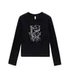 Camiseta blanca de mujer con cuello redondo, hombros normales, manga larga, nuevo estilo primavera y otoño, estampado de dibujos animados de nicho, corte ajustado, top moderno y versátil