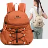 Mochila pequeña impermeable ligera estilo japonés para comercio exterior transfronterizo, deportes, modelo nuevo 2026, mochila para mujer para viajes al aire libre y ocio