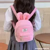 Mochila pequeña de felpa con orejas de conejo para mujer 2026 Nuevo estilo Mochila mini para niños Bolsa linda de corazón femenino