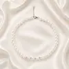 Accesorios de moda europeos y americanos populares transfronterizos, collar y pendientes de perlas vintage de nicho, juego de collar elegante estilo lujo ligero