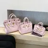 Bolso de Mano de Cuero Genuino con Hebilla Chapada en Oro Platino Patrón Lichi Gran Capacidad Bolso Tipo Kelly para Mujer 2026 Nuevo Bolso de Hombro de Moda Tendencia