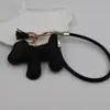 Funda para teléfono con borla de cachorro linda creativa, correa para llavero de coche, accesorio para bolso, universal para teléfonos móviles