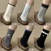 Calcetines de algodón peinado a rayas para mujer de otoño e invierno, calcetines de encaje de estilo coreano de moda hasta la pantorrilla, calcetines dulces de moda con lunares y volantes para mujer