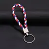 Llavero colgante de cuerda de cuero tejido de fábrica con cabeza de plástico para pareja, llavero de coche de cuero, colgante, accesorios, venta al por mayor