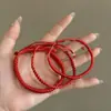 Cuerda roja tejida a mano, pulsera minimalista, cuerda para la mano de pareja, regalo de cumpleaños, regalo de Año Nuevo