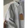 Camisa retro de estilo japonés Oxford a rayas, de manga larga, corte holgado, casual, con cuello de solapa, adecuada como camisa de trabajo o prenda exterior de otoño para ir al trabajo.