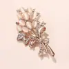 Nuevo corsage de piedra ojo de gato con pedrería, broche de ramo de tulipanes con accesorios de pasador anti-luz para ropa de alta gama, mujer