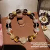 Nove Roxo de Fogo Roxo do Leste Ponto Diamante Abóbora Gema Pulseira Novo Tigre Chinês Olho Cristal Pequeno Homem Cintura Pulseira
