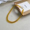 Collar de cuentas amarillas simples vintage de Corea del Sur para mujer, cadena de clavícula apilada blanca con diseño de nicho de lujo ligero