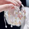 Pulsera tejida de trébol de cuatro hojas hecha a mano, regalo de la suerte de nicho para parejas y amigos, pulsera de estrella de la suerte simple y exquisita