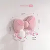 Portacepillos de dientes con forma de lazo y doble orificio, alto valor estético, gancho sin rastro, no requiere taladro, un excelente artículo de almacenamiento para el hogar
