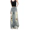 Jeans rasgados de design de rua americano 2026 para mulheres, novas calças de perna larga retas soltas emagrecedoras vintage de verão