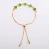 Pulsera de trébol de cuatro hojas con cruz de circonita para mujer, dulce, de alta gama, nicho, versátil para Instagram, joyería para mano con flor