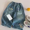 Jeans de alta qualidade para meninos e meninas, novo estilo primavera e outono 2026, estampa de desenho animado, retalhos, calça curva versátil