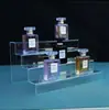 Estante de Almacenamiento Multicapa de Acrílico con Exhibición Tipo Escalera para Figuras, Cajas Sorpresa y Almacenamiento y Exhibición de Cosméticos
