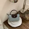 2026 Nova Bolsa de Ombro Transversal Casual Nicho Estilo Coreano, Bolsa de Ombro Simples e Fashion para Mulheres, Bolsa Mini Fofa de Bolinho