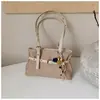 Bolso de mano retro de color sólido de gran capacidad estilo coreano, nuevo modelo 2026, simple y moderno, adecuado para el trabajo y los desplazamientos, bolso de hombro de moda
