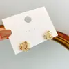 Brincos de Girassol com Pedra Olho de Gato de Alta Qualidade 2026 Novos Brincos da Moda para Mulheres Estilo Retrô de Luxo Leve Brincos de Celebridade da Internet