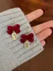 Pendientes de botón con lazo festivo de terciopelo rojo para mujer, pendientes elegantes y dulces con forma de flor y borla larga, pendientes de otoño e invierno