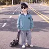 Jaqueta Infantil Outono 2026 Novo Estilo Coreano Tendência Jaqueta com Capuz Xadrez para Menino Roupas de Outono para Crianças