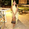 Roupas femininas de cor sólida para comércio exterior, estilo europeu e americano, vestido simples sem mangas, saia irregular de luxo leve, vestido solto da moda de rua com gola alta