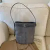 Estilo ins coreano nicho personalidad hebilla de cinturón diseño moderno simple gamuza retro bolso de hombro bolso cubo mujer