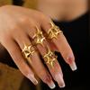 Anillo de estrella de viento frío con revestimiento de acero de titanio chapado en oro real de 18 quilates para hombre y mujer, estilo europeo y americano.