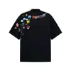 Chegada Nova 2025 Estilo Americano Marca de Moda Criativa Estampa Graffiti de Desenho Animado Camiseta de Manga Curta para Homens e Mulheres High Street Casal Gola Redonda Manga Curta
