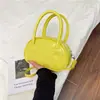 Bolso de mano de color liso estilo coreano para mujer, nueva colección de verano 2025, bolso con forma de concha moderno y chic, bolso cruzado moderno y casual