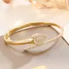 Brazalete abierto con incrustaciones de diamantes, de estilo transfronterizo, adecuado para bodas, cenas y eventos, ofreciendo un brazalete de circón de lujo ligero, de alta gama y nicho