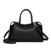 Bolso tipo almohada de alta gama estilo coreano para mujer 2026 Nuevo bolso tote pequeño de alto valor para el trabajo, casual, de nicho, cruzado, de mano