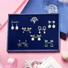 Corea del Sur Dongdaemun Pendientes de plata de ley 925 para mujer, pendientes de una semana, combinación de caja de regalo, dulces pendientes de oso hueco con perlas para niñas