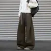 Pantalones de mujer de estilo americano de alta gama, plisados, corte curvo, nuevos pantalones de pierna ancha para la primavera 2026, pantalones casuales sueltos y con caída.