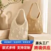 Bolso de mano tejido hueco, nuevo bolso de hombro simple, versátil y elegante, bolso de playa estilo vacacional, bolso de mano de moda para mujer