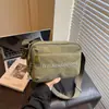 Bolso de tela casual para mujer con estampado de letras, nuevo modelo 2026, moda nicho para exteriores, ligero y versátil, adecuado para ir al trabajo, bolso de hombro y cruzado