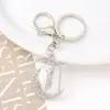 Llavero de letras plateadas 'Explosiones Transfronterizas' colgante de coche accesorio de bolso de metal con diamantes de imitación joyería llavero al por mayor