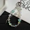 Nueva cadena para teléfono de borla de mariposa con cuentas en forma de estrella, ligera, lujosa y delicada, perfecta para bolsos de niñas y como llavero
