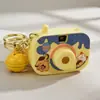 Cámara de simulación de proyección de dibujos animados llavero de moda colgante para bolso de niña pequeña juguete pequeño cuerda para la mano venta al por mayor