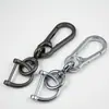 Creativo Sencillo Colgante de Cintura para Llaves de Coche Gancho para Bolso Hebilla Colgante Accesorios Dos Llaveros de Aleación de Zinc Fabricante Venta al por Mayor