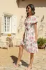 Producto Nuevo Transfronterizo 2025 Verano Europeo y Americano Nuevo Vestido de Playa con Estampado de Dobladillo Ancho, Cuello en V, Cintura Alta, Manga Corta, Vestido de Gasa