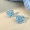 Pendientes de flor de hielo azul claro de alta calidad, pendientes pequeños de flor azul frescos y dulces, pendientes de temperamento súper de hada para vacaciones, mujer
