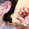 Pendientes de circonita coloridos pendientes pequeños exquisitos 2023 nuevos pendientes de anillo estilo occidental femenino alto sentido