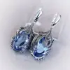Huajie Popular Clásico de Moda Transfronterizo Imitación Oro Blanco Incrustado Zirconia Azul Pendientes Creativos para Mujer Venta Directa de Fábrica