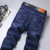 Jeans Elásticos para Hombre Modernos Holgados Rectos Otoño Nuevos Pantalones Casuales Resistentes al Desgaste Pantalones de Protección Laboral Pantalones de Verano Venta al por Mayor