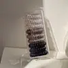 9 Anéis de Cabelo de Linha Telefônica de Sentido Avançado Embalados Corda de Cabelo Feminina Corda de Cabeça Simples Estilo Ins Faixa de Couro Acessório de Cabeça para Jaqueta de Couro Atacado