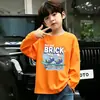 Camiseta de moda de manga larga 100% algodón para niños, nuevo modelo primavera 2026, top sencillo de dibujos animados para niños mayores y pequeños